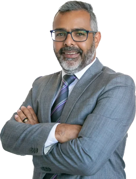 experienced-businessman-standing-office-room-indian-content-office-employee-eyeglasses-smiling-posing-with-folded-hands-business-management-corporation-concept copy